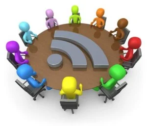 Diverse Group Of Colorful Business People Seated At A Round Conf